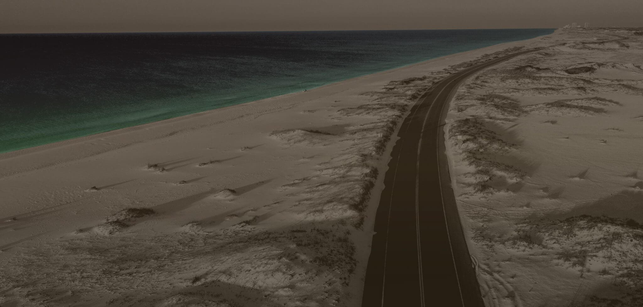 Beach road on the Emerald Coast, home of Rollins Distillery
